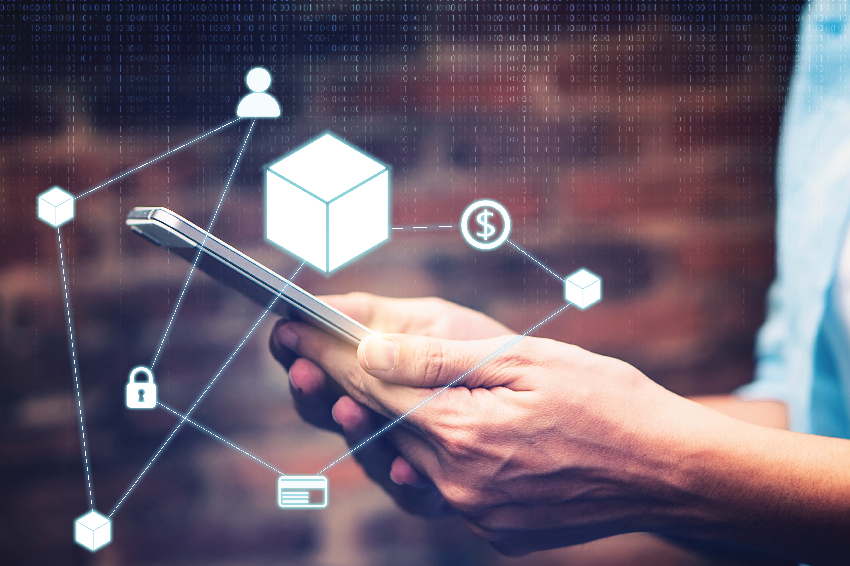 Double exposure of a person holding a smartphone and supply chain finance with icons.
