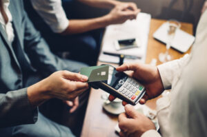 A closeup shot of a card payment being done by an entrepreneur illustrating supply chain financing.