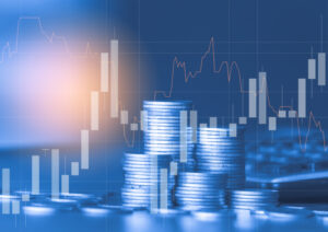 A double exposure image of a stack of coins and a stock growth graph illustrates the benefits of open finance for SMEs.