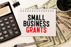 In a writing note, the text titled "Small Business Grants" illustrates how to apply for a small business grant.